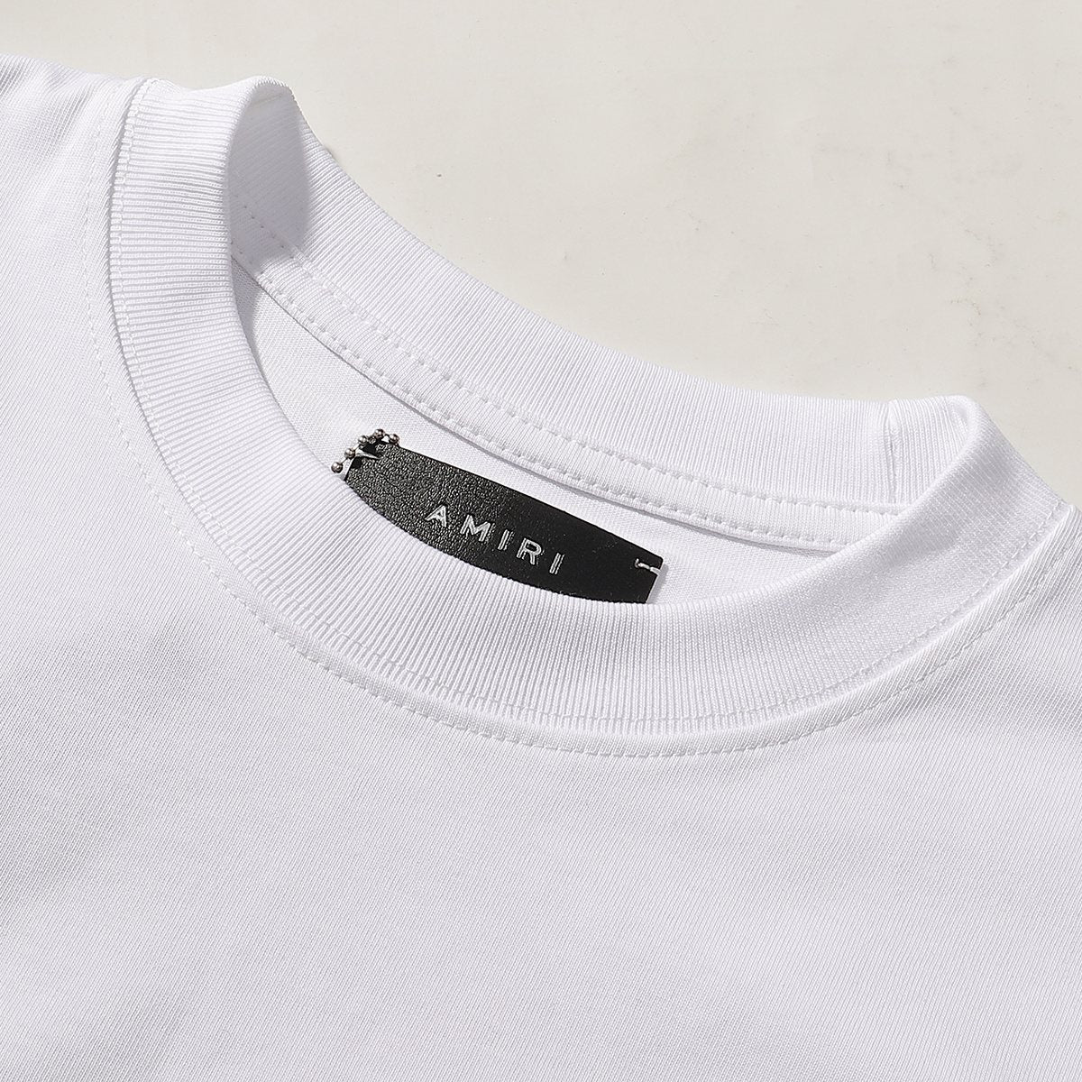 AMIRI Letter Graphic T-Shirt — neck_label